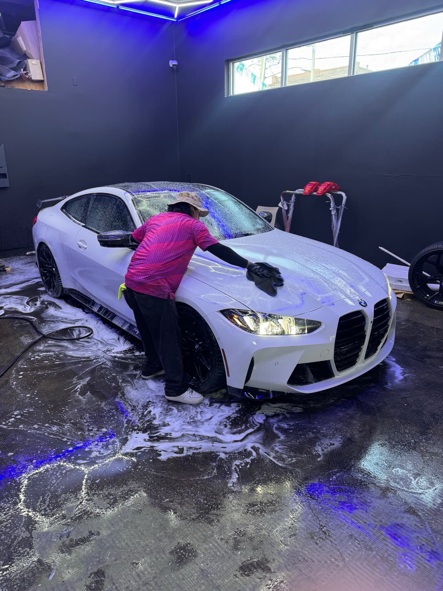 White BMW M4 G82 hand wash service
