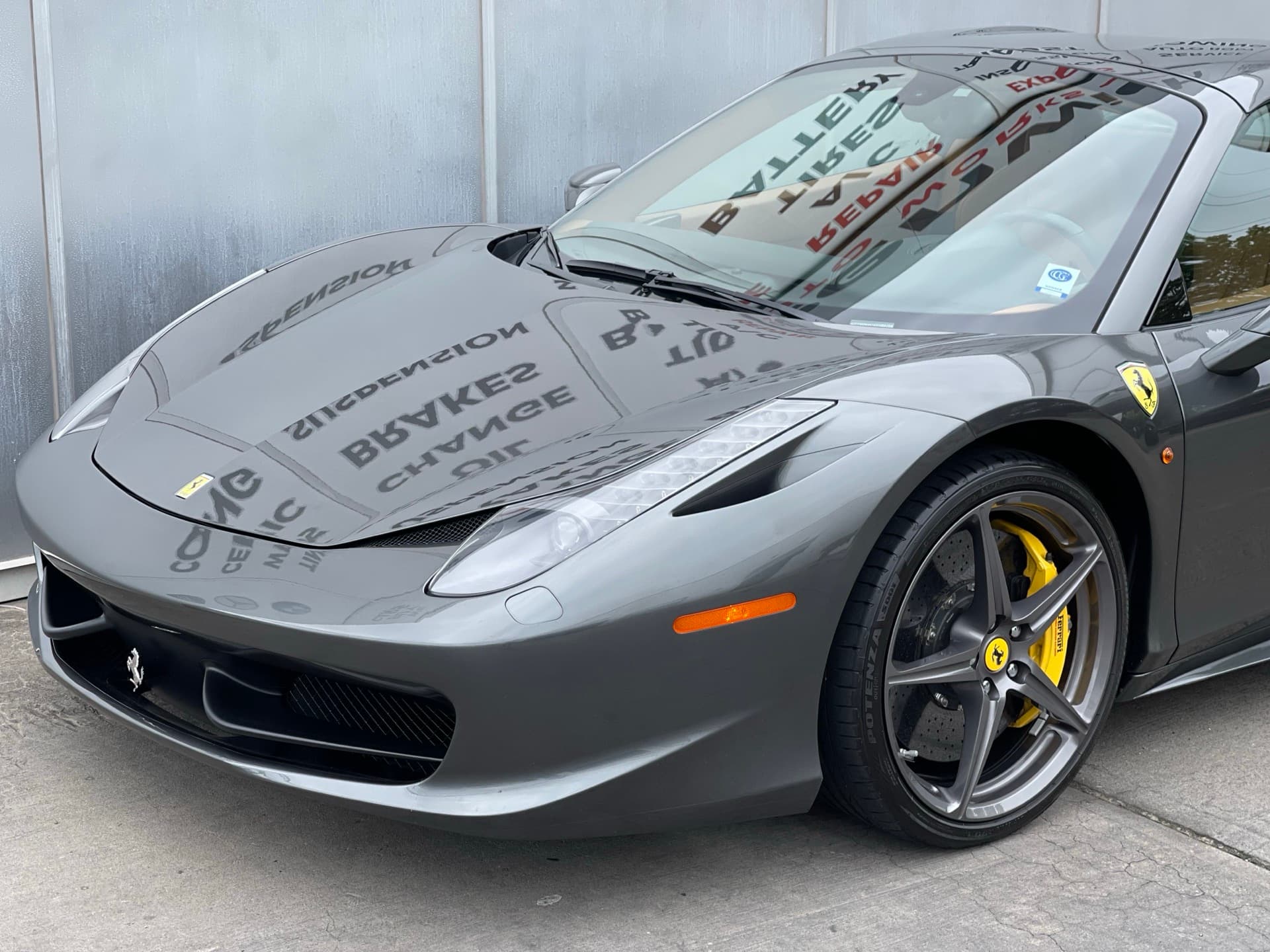 Gray Ferrari 458 Italia with yellow brake calipers