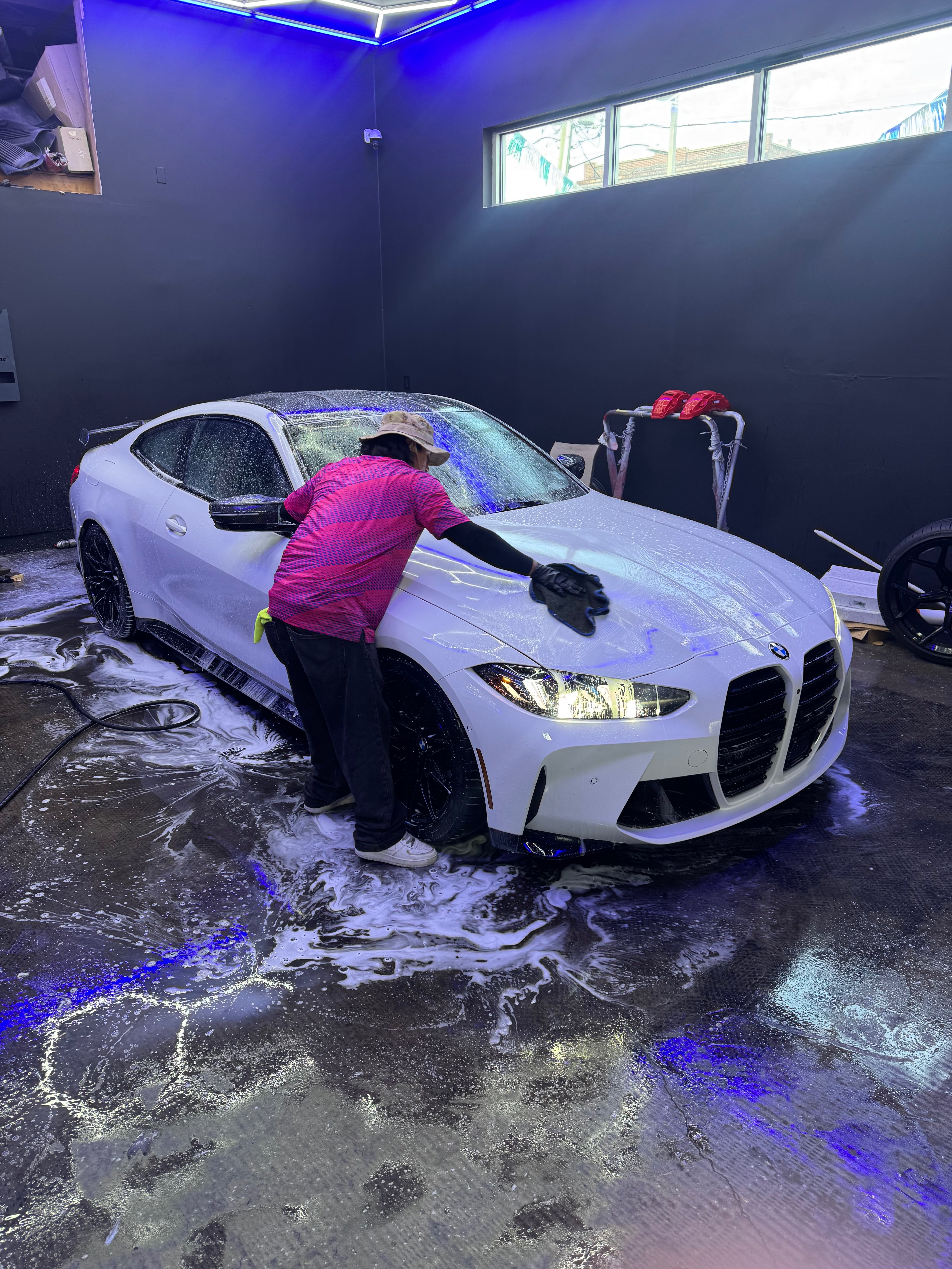 White BMW M4 G82 hand wash service
